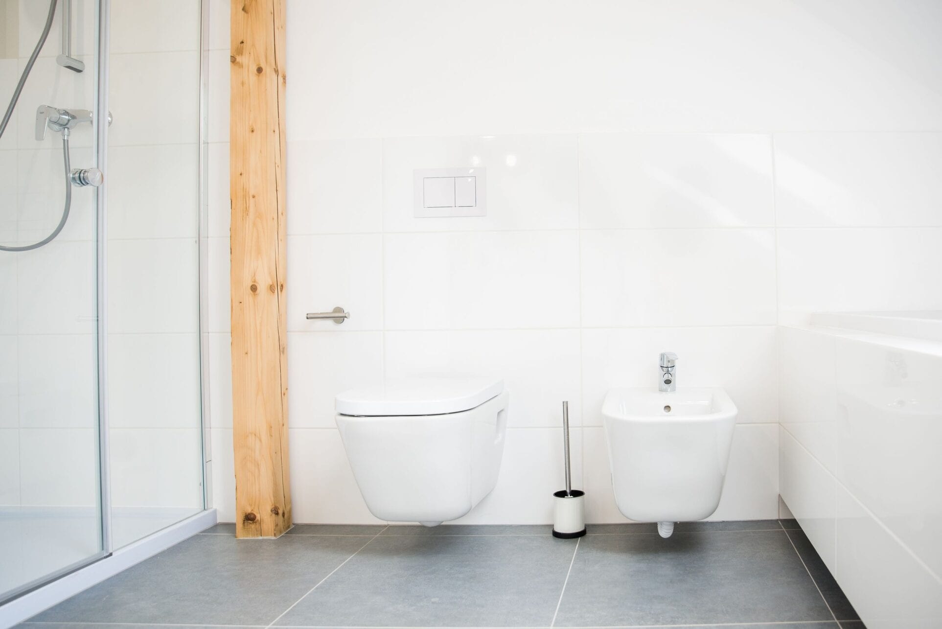 White modern toilet and bidet Flo-Essence Plumbing, Hearth and Decor Ltd - Toilet Sinks