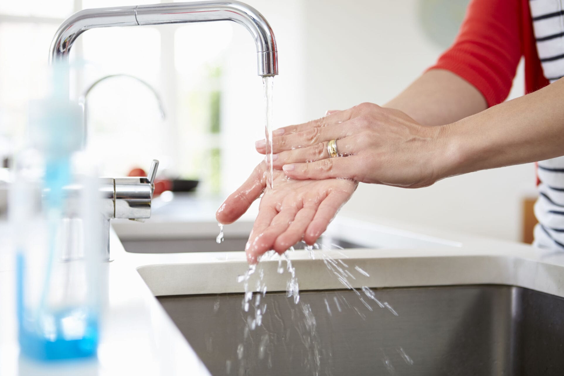 Close Up Of Woman Washing Hands In Kitchen Sink Kitchen Sinks Handling kitchen waste is a breeze